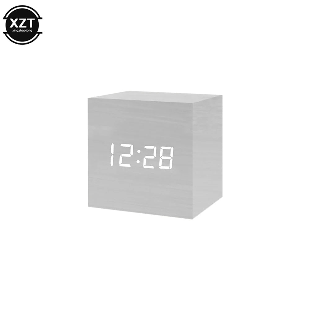 Digital clock with white cube design displaying time on a white background, featuring the brand 'XZT'.